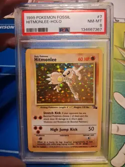 1999 Pokemon Fossil 1st Edition Hitmonlee Holo Card 7/62 PSA 8 NM-MT - Image 1