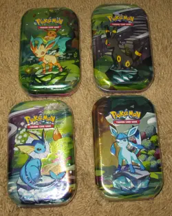 POKEMON: TCG, SCARLET & VIOLET, PRISMATIC EVOLUTIONS MINI TIN, LOT OF 4, SEALED - Image 1