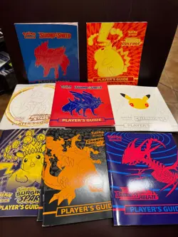 Pokemon TCG Assorted 11 LOT ETB Players Guide Book Elite Trainer Books - Image 1