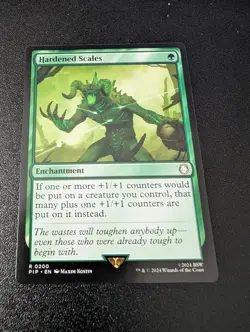 1x Hardened Scales - Universes Beyond: Fallout - NM - MTG - Image 1