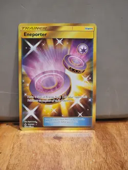 ENEPORTER 142/131 Pokemon TCG SM Forbidden Light * Gold Secret Rare - Image 1