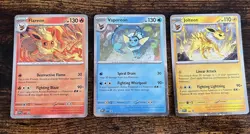 Pokemon TCG: Prismatic Evolutions Poster Collection Cosmos Holo Promos Set of 3 - Image 1
