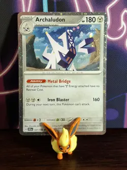 Pokemon SV: Stellar Crown 107/142 Archaludon: Cosmos Holo Blister Exclusive** - Image 1