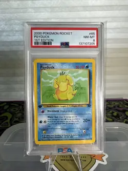 1999 POKEMON FOSSIL 1ST EDITION #53 PSYDUCK PSA 8 - Image 1