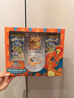 Pokemon Charizard Set – Indonesian Exc– 2 Booster Packs, Promo Card & Keychain - Image 1