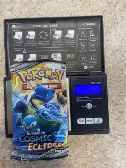 Pokemon COSMIC ECLIPSE Heavy Booster Pack Sealed - Image 1