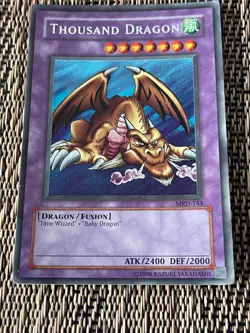 Heavily Played Unlimited Thousand Dragon Secret Rare Metal Raiders MRD-143 HP - Image 1