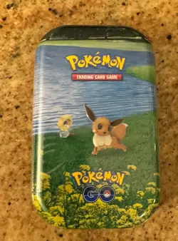 Eevee Pokemon GO Mini Tin *2 Booster Packs, 1 Coin, 1 Art Card Pokemon TCG *New* - Image 1