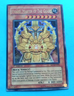 YUGIOH EXXOD, MASTER OF THE GUARD SD7-EN001 1ST ED ULTRA RARE VERY LIGHT PLAY - Image 1