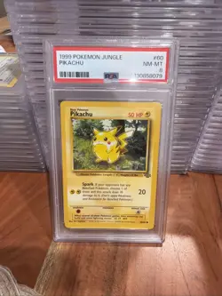 1999 Pokemon Jungle Pikachu #60/64 PSA 8 - Image 1