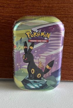 Pokemon Prismatic Evolutions Umbreon Mini Tin – 2 Packs – Eevee Coin – Sealed - Image 1
