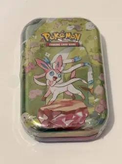 POKEMON TCG PRISMATIC EVOLUTIONS SYLVEON MINI TIN PACKS, COIN,ART CARD SEALED - Image 1