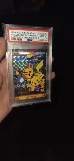 1999 Japanese Pokemon Bandai Carddass Pikachu/Elekid Prism Holo Movie 24 -PSA 10 - Image 1