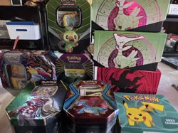Lot of 9 2015+ Empty Pokemon Collection Tins & Cards & Stickers 2025 Calendar - Image 1