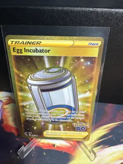 Egg Incubator Gold Trainer 087/078 Pokemon TCG SWSH Pokemon Go Gold Secret Rare - Image 1