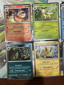 Pokemon - Prismatic Evolutions - Costco Mini Tin Cosmo Promos 8 Umbreon Sylveon - Image 2