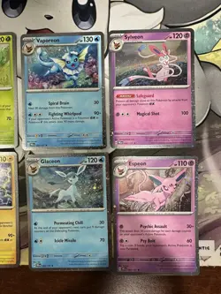 Pokemon - Prismatic Evolutions - Costco Mini Tin Cosmo Promos 8 Umbreon Sylveon - Image 3