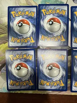 Pokemon - Prismatic Evolutions - Costco Mini Tin Cosmo Promos 8 Umbreon Sylveon - Image 4