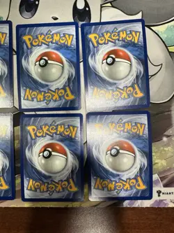 Pokemon - Prismatic Evolutions - Costco Mini Tin Cosmo Promos 8 Umbreon Sylveon - Image 5