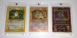 Preowned Pokemon TCG Base Set Holo Charizard, Holo Raichu, And Holo Ancient Mew - Image 1
