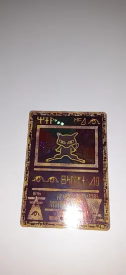Preowned Pokemon TCG Base Set Holo Charizard, Holo Raichu, And Holo Ancient Mew - Image 4
