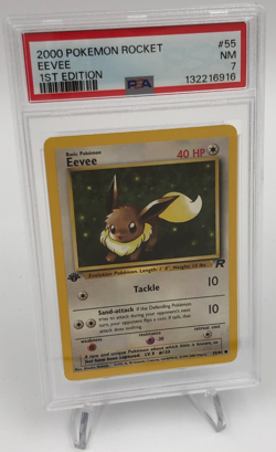 POKEMON Trading Card 2000 TEAM ROCKET 55/82 EEVEE 1st EDITION grade slab PSA 7 - Image 1