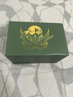 One Piece CCG Roronoa Zoro Green Plastic Deck Box with Pirate Logo - Image 1