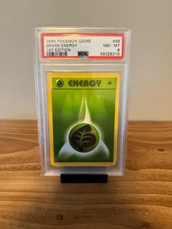 Pokemon Grass Energy #99 1st Edition 1999 Base Set PSA 8 - Image 1