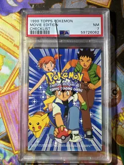 1999 TOPPS POKEMON THE MOVIE EDITION CHECKLIST MOVIE EDITION PSA 7 (Read/Cracked - Image 1