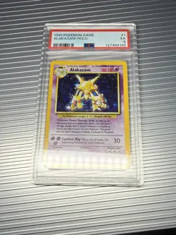 1999 POKEMON GAME ALAKAZAM HOLO BASE SET 1/102 PSA 5 WOTC VTG - Image 1