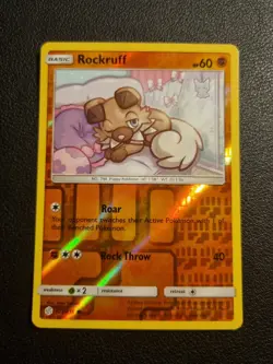 REVERSE HOLO Pokemon Sun & Moon Cosmic Eclipse TCG Card Rockruff 123/236 - Image 1