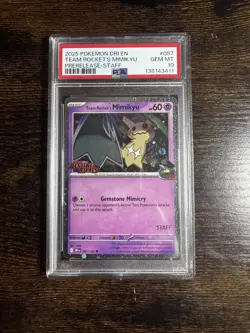 2025 Pokemon DRI EN Pre-Release Staff #087 Team Rocket's Mimikyu PSA 10 - Image 1