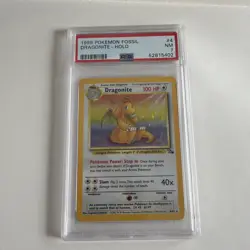 1999 POKEMON FOSSIL #4 DRAGONITE-HOLO PSA 7 - Image 1