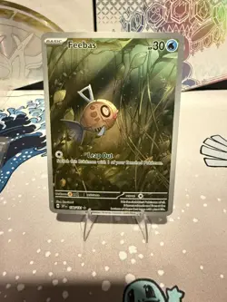 Feebas 198/191 Sv08: Surging Sparks Holo Pokemon card - Image 1