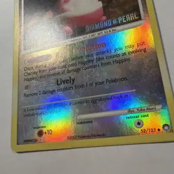 Happiny 52/123 Reverse Holo Pokemon Card Diamond & Pearl 2007 Stamped - Image 3