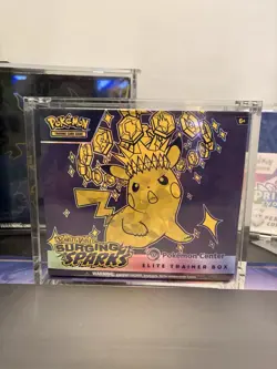 Surging Sparks Pokemon Center ETB with Acyrlic Case Brand New Perfect Condition - Image 1