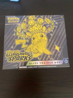 Pokemon Surging Sparks POKEMON CENTER ETB – Factory Sealed – Brand New - Image 1