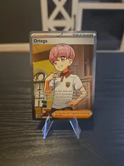 Pokemon TCG Ortega Ultra Rare Full Art Trainer Holo 141/131 Prismatic Evolutions - Image 1