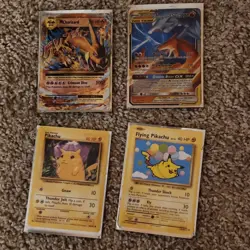Pokemon TCG 4 Card Lot - Charizard, Pikachu, Reshiram, Tag Team GX - Image 1