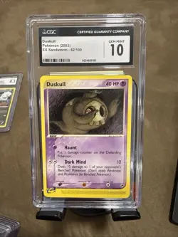 Pokemon Duskull 2003 EX Sandstorm 62/100 CGC 10 - Image 1