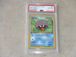 1999 POKEMON FOSSIL SHELLDER 1ST EDITION CARD #54 POKEMON PSA 10 - Image 1