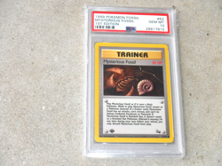 1999 POKEMON FOSSIL MYSTERIOUS FOSSIL 1ST EDITION TRAINER CARD #62 PSA 10 - Image 1