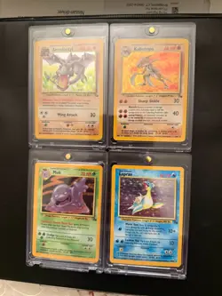 4 NEAR MINT POKEMON FOSSIL MIXED COLLECTION (AERODACTYL, KABUTOPS, MUK, LAPRAS) - Image 1