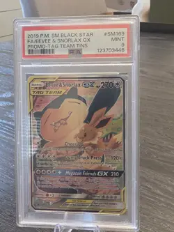 Pokemon Eevee & Snorlax 2019 SM Black Star Promo Tag Team GX SM169 PSA 9 - Image 1