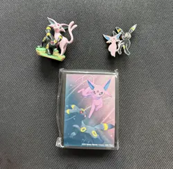 Pokemon TCG - Prismatic Evolutions Figure Collection Sleeves, Pin and Figurine - Image 1