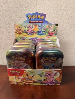Pokemon TCG: Prismatic Evolutions Full Set Of 8 Sealed Mini Tins With Display - Image 1