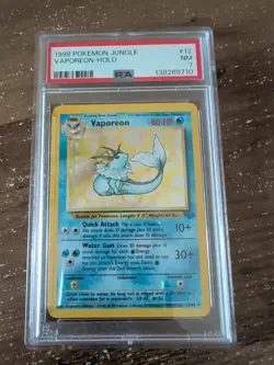 Vaporeon 12/64 Holo Rare Pokemon 1999 Jungle PSA 7 NM - Image 1
