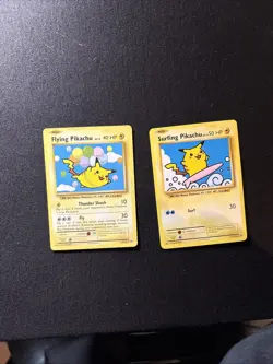 Flying Pikachu & Surfing Pikachu Pokemon Cards Set - Image 1