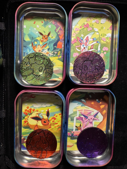 Pokemon- Prismatic Evolutions *EMPTY* Mini Tins, Set of 4 with Cards and Coin! - Image 1