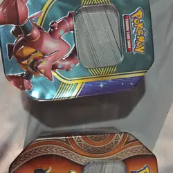 Pokemon Trading Card Game Mixed Card Lot in Tins - Image 1